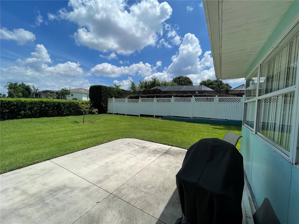 2818 Summit Drive Sebring, FL 33870 - Photo 27 of 28 a view of a swimming pool with a yard