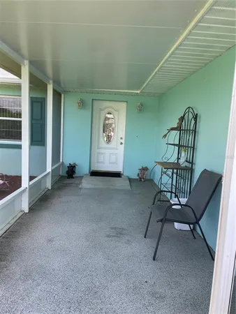 a view of a livingroom with furniture and windows