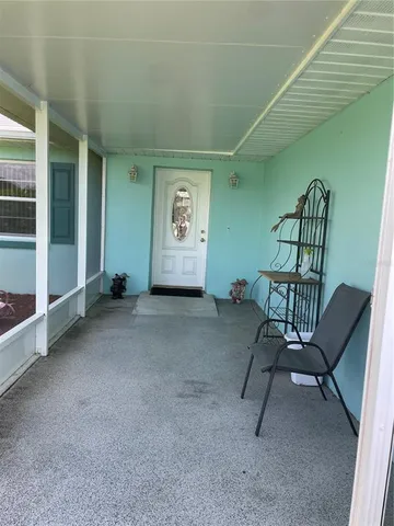 a view of a livingroom with furniture and windows