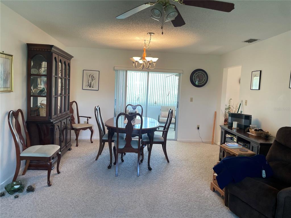 2818 Summit Drive Sebring, FL 33870 - Photo 7 of 28 a view of a livingroom and dining room