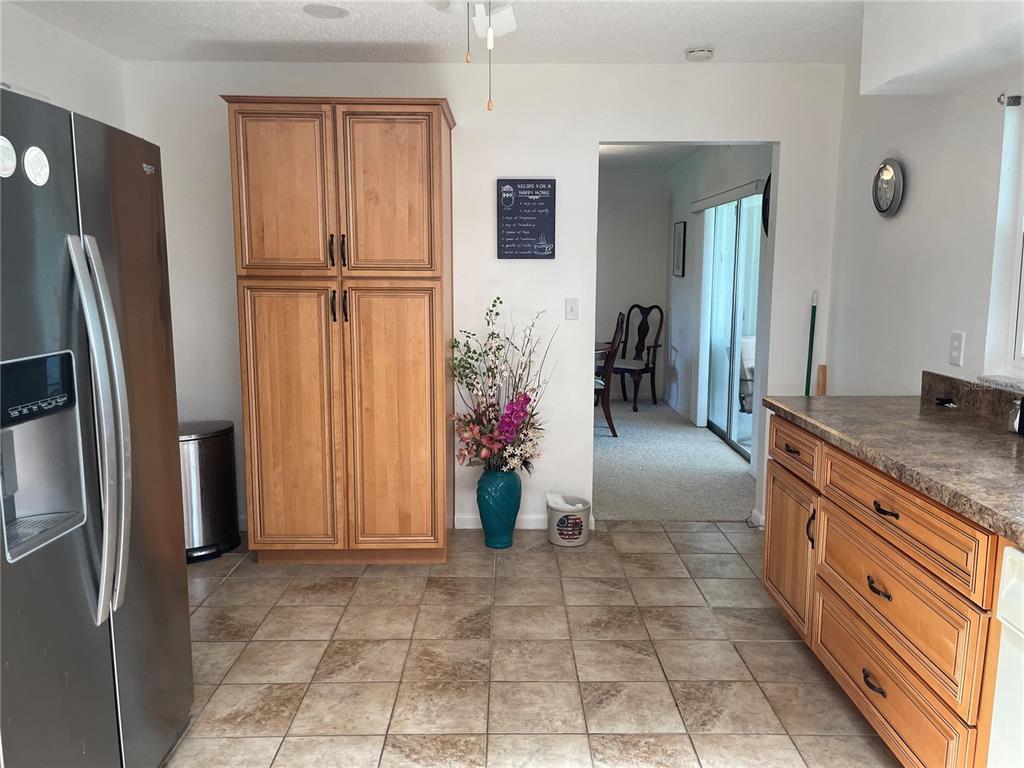 2818 Summit Drive Sebring, FL 33870 - Photo 10 of 28 a kitchen with stainless steel appliances granite countertop a refrigerator and a sink