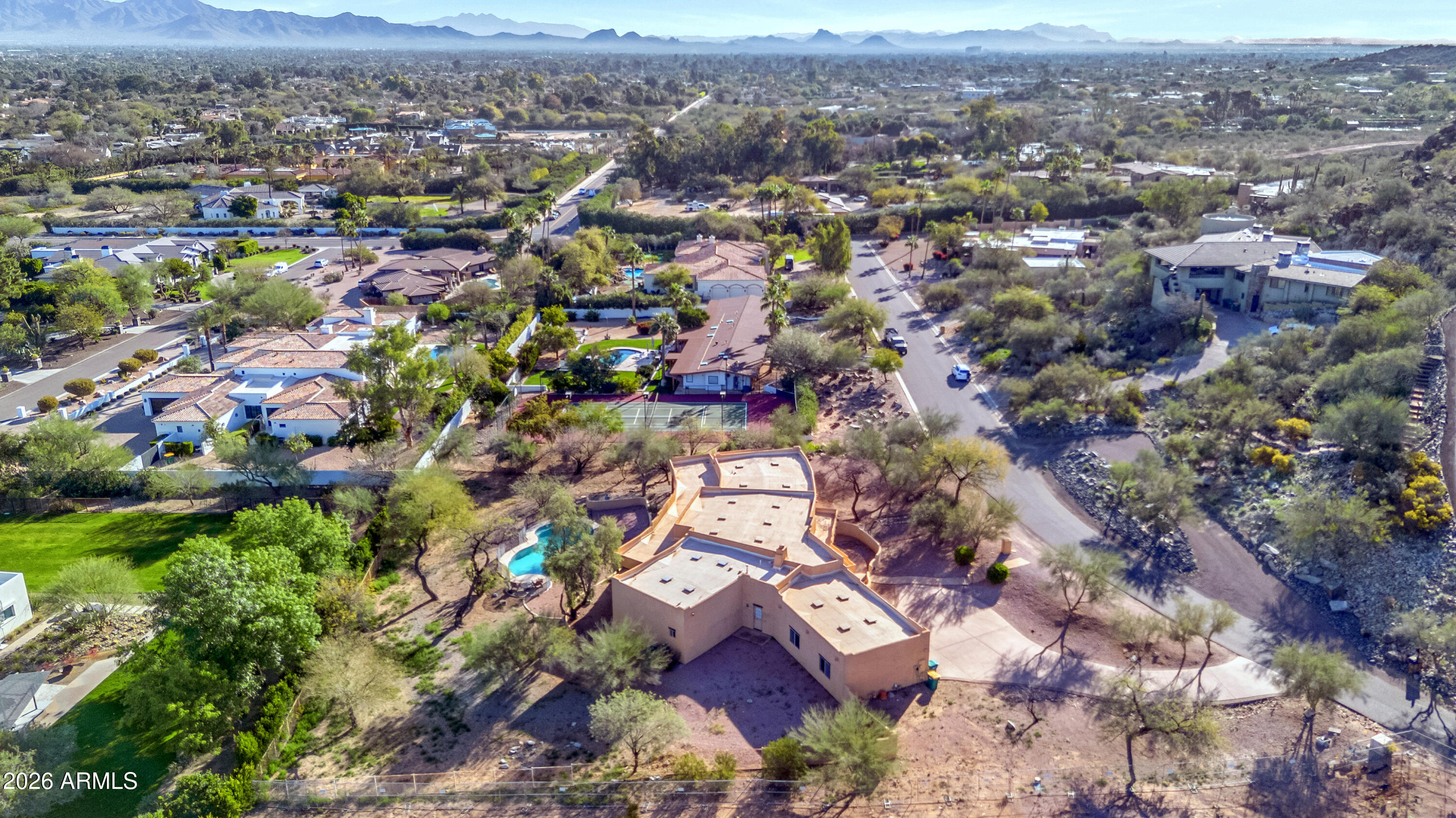 5454 East Royal Palm Road, Unit 29 Paradise Valley, AZ 85253 - Photo 2 of 13 an aerial view of residential houses with outdoor space