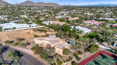 an aerial view of a house with a yard