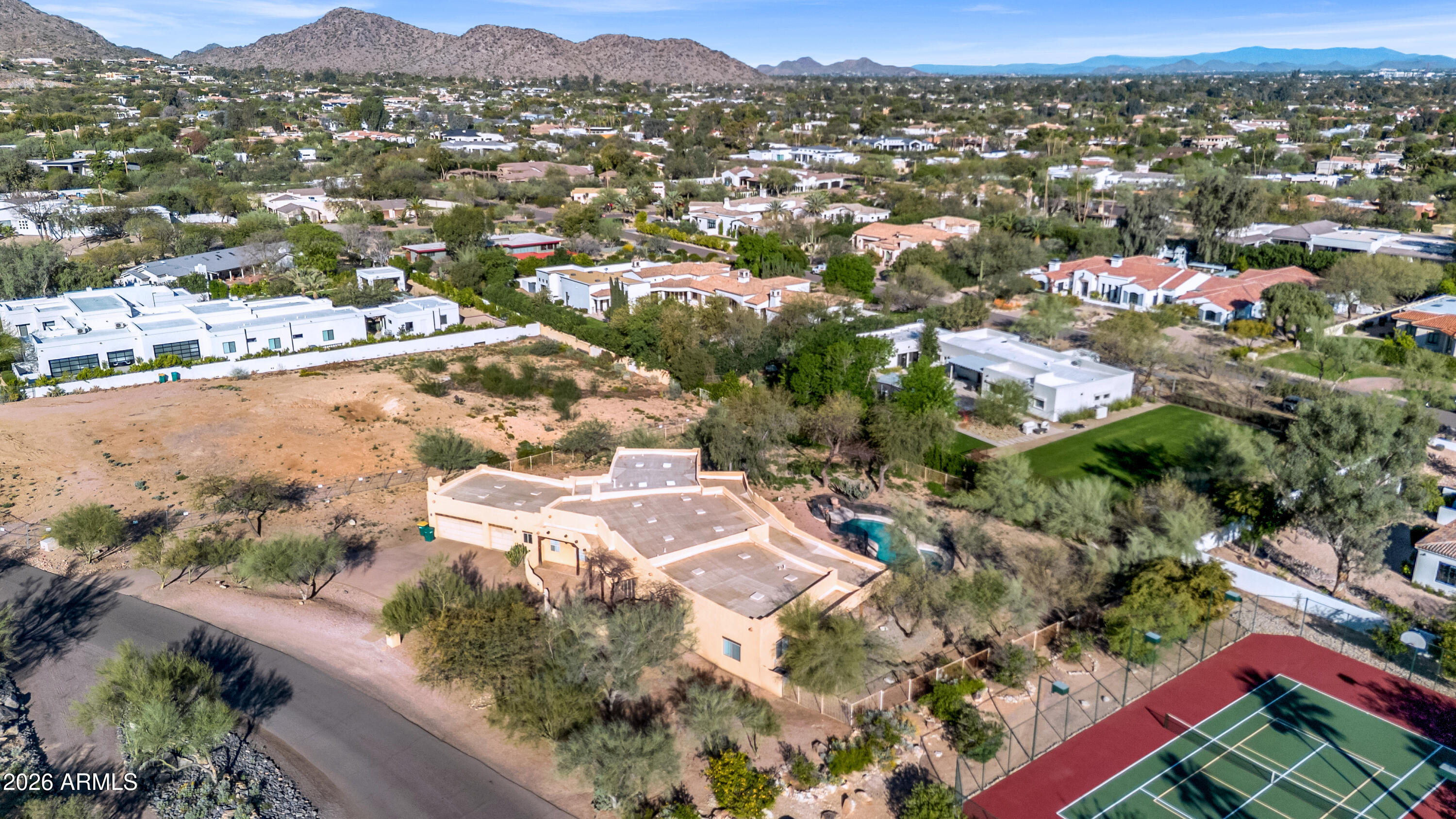 5454 East Royal Palm Road, Unit 29 Paradise Valley, AZ 85253 - Photo 4 of 13 an aerial view of residential houses with outdoor space