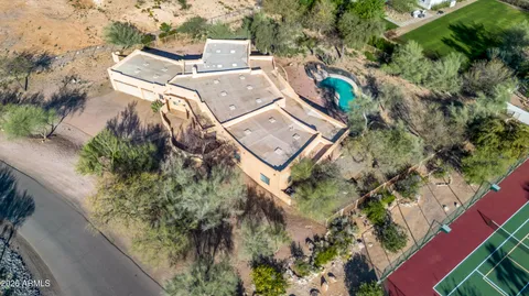 an aerial view of a house with mountain view