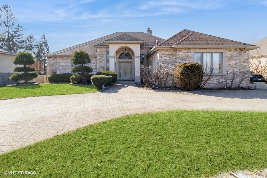 4N240 7th Avenue Addison, IL 60101 - Photo 1 of 3 a front view of a house with garden