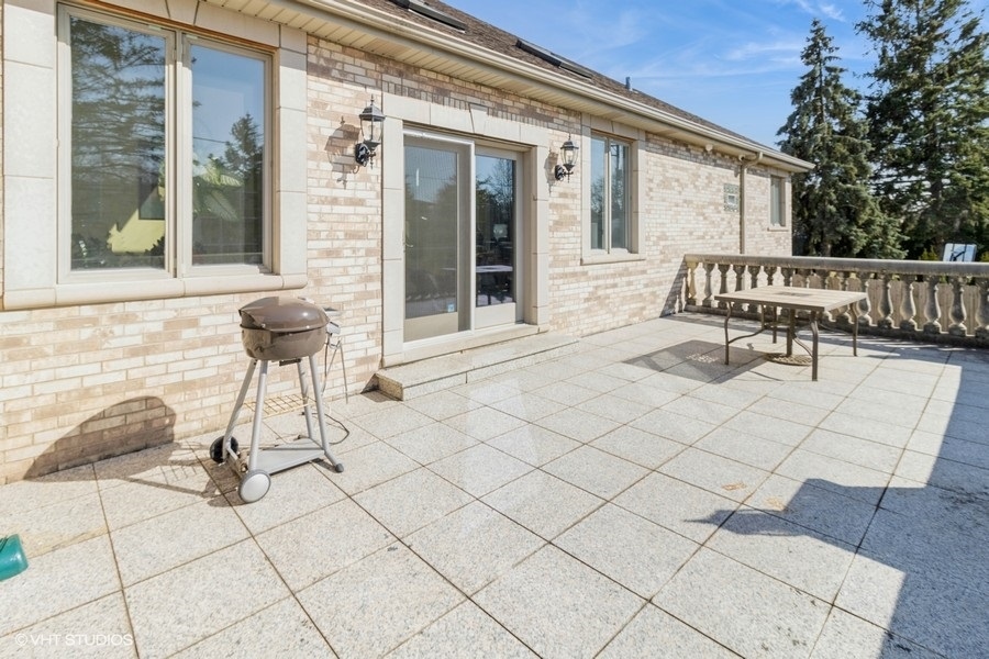 4N240 7th Avenue Addison, IL 60101 - Photo 2 of 3 a view of balcony with two chairs and a large window
