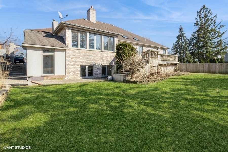 4N240 7th Avenue Addison, IL 60101 - Photo 3 of 3 a big house with a big yard and more windows