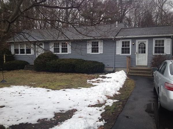 80 Carpenter Road Northbridge, MA 01588 - Photo 1 of 17 a front view of a house with a yard covered in snow