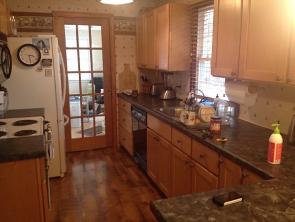 80 Carpenter Road Northbridge, MA 01588 - Photo 16 of 17 a kitchen with stainless steel appliances wooden cabinets counter space and a window