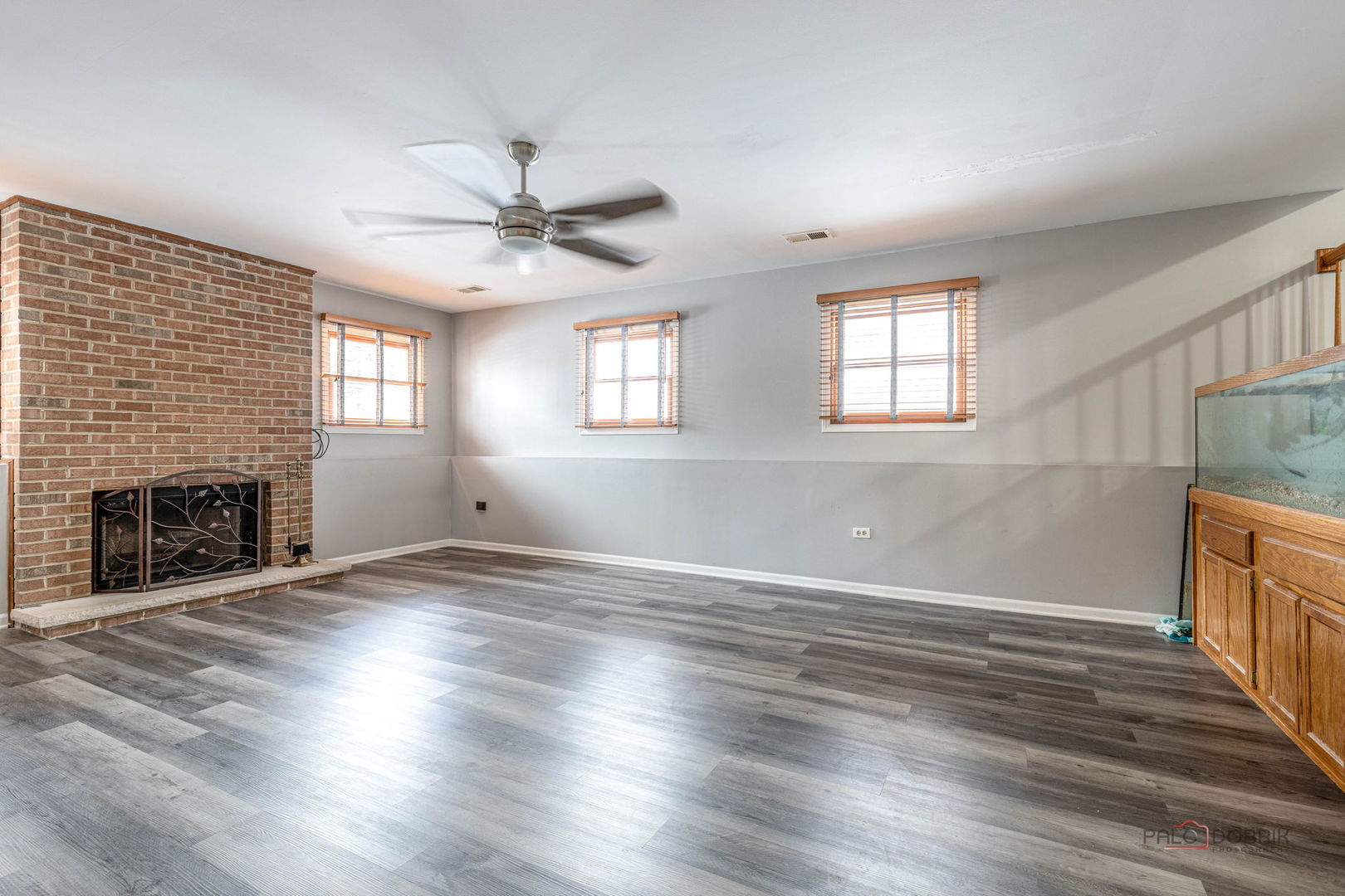 1716 Red Bud Road Bolingbrook, IL 60490 - Photo 13 of 38 an empty room with wooden floor fireplace and windows