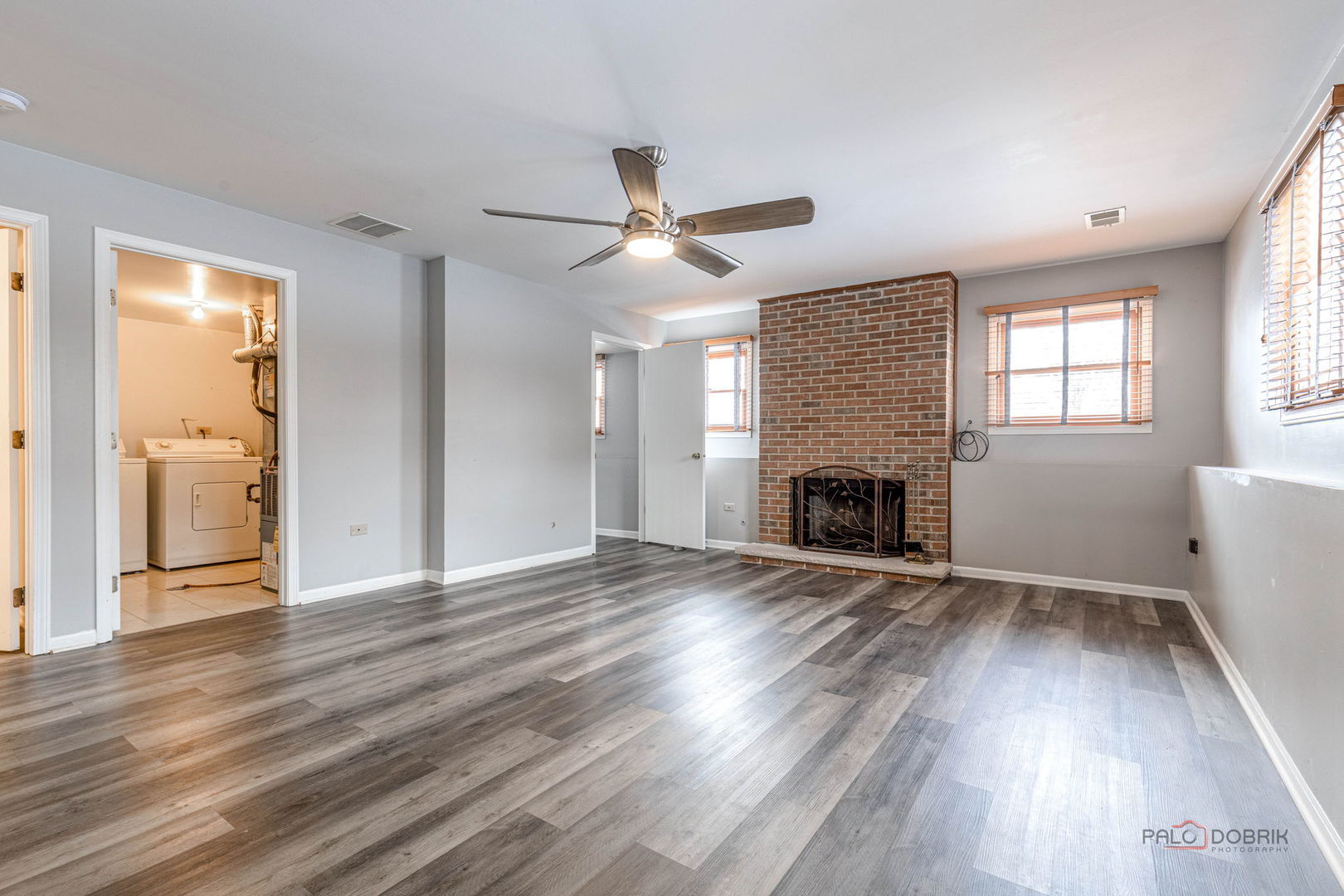 1716 Red Bud Road Bolingbrook, IL 60490 - Photo 15 of 38 an empty room with wooden floor fireplace and windows