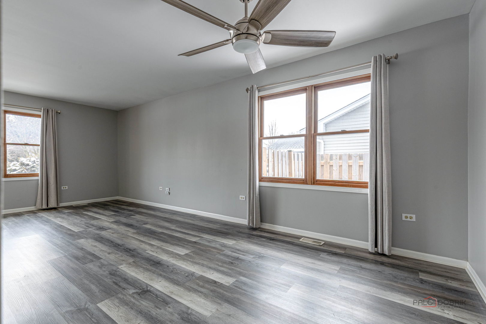 1716 Red Bud Road Bolingbrook, IL 60490 - Photo 17 of 38 an empty room with wooden floor fan and windows