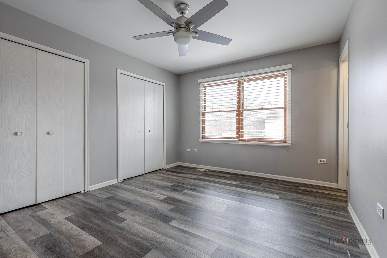 1716 Red Bud Road Bolingbrook, IL 60490 - Photo 18 of 38 a view of an empty room with a window and wooden floor