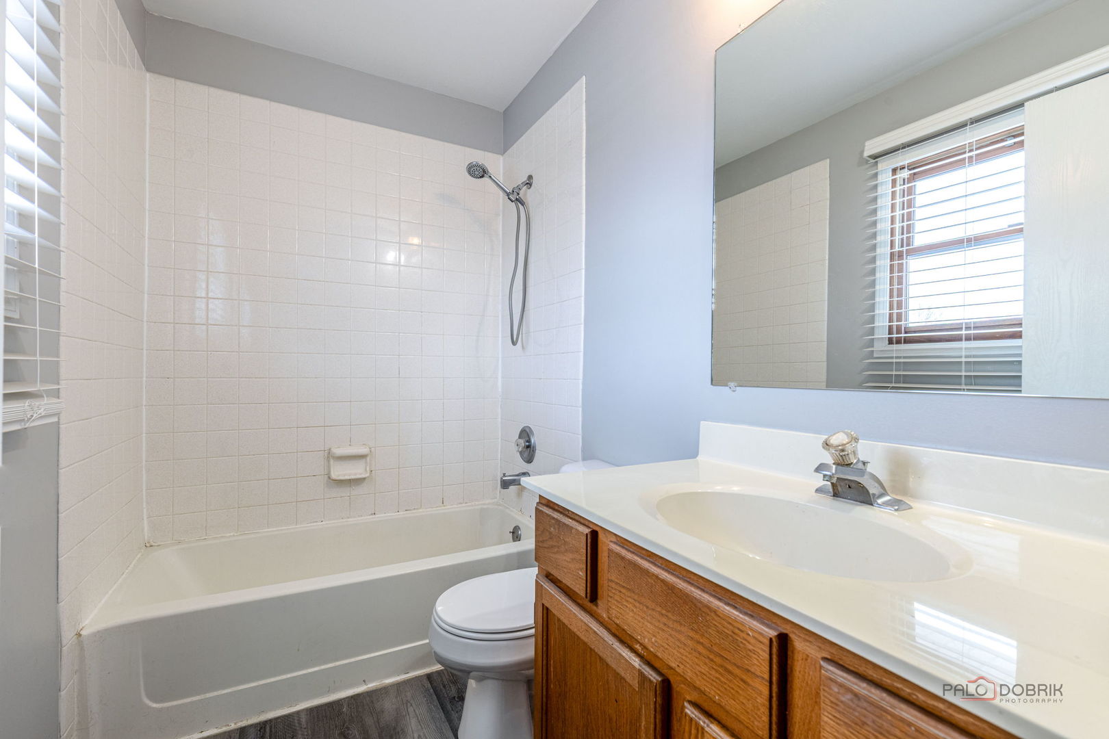 1716 Red Bud Road Bolingbrook, IL 60490 - Photo 23 of 38 a bathroom with a sink a toilet and a bathtub