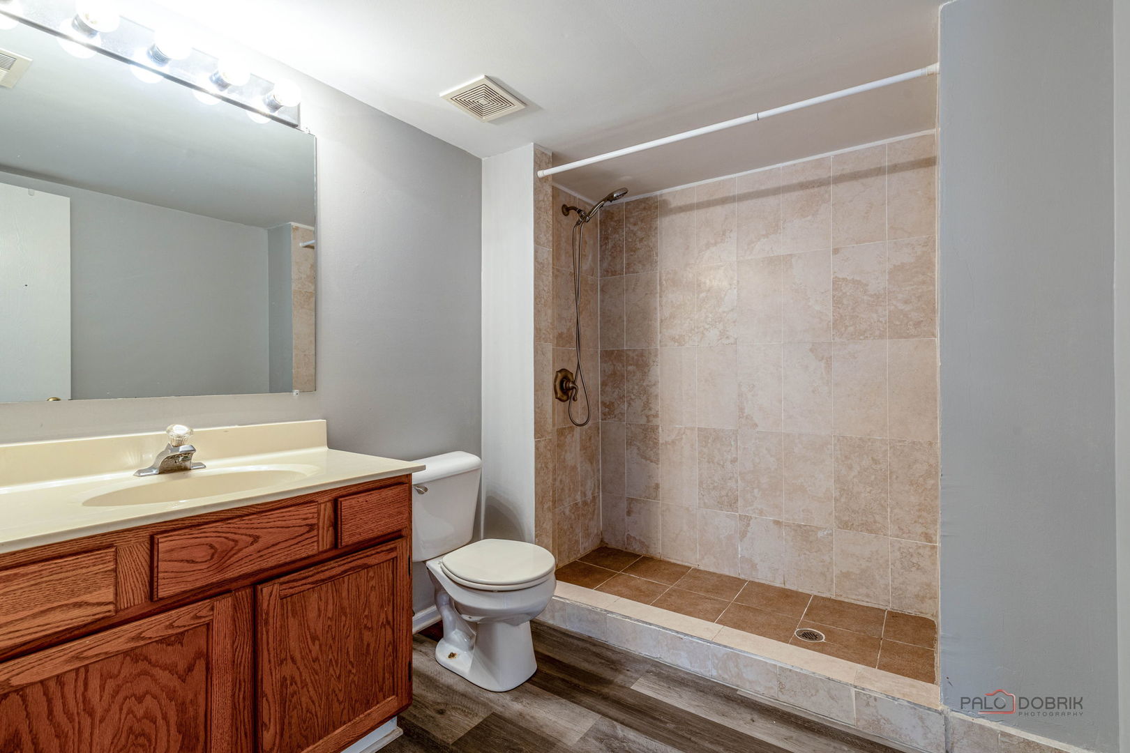 1716 Red Bud Road Bolingbrook, IL 60490 - Photo 26 of 38 a bathroom with a sink and a mirror