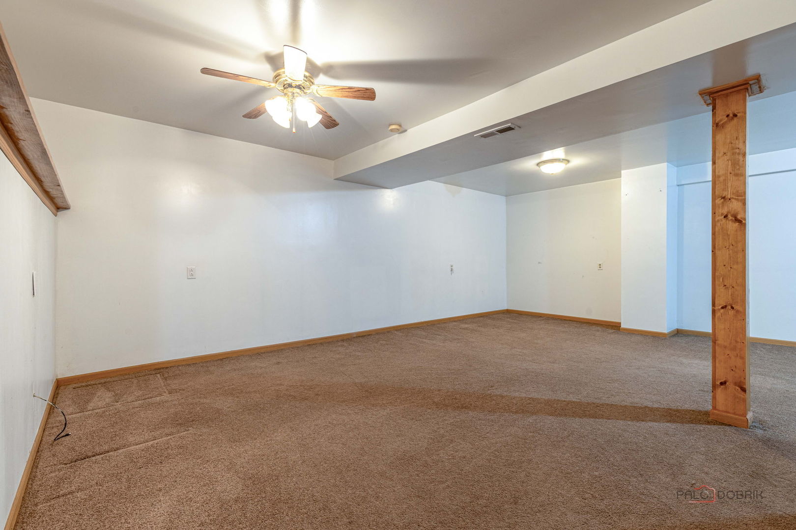 1716 Red Bud Road Bolingbrook, IL 60490 - Photo 27 of 38 an empty room with chandelier fan and windows