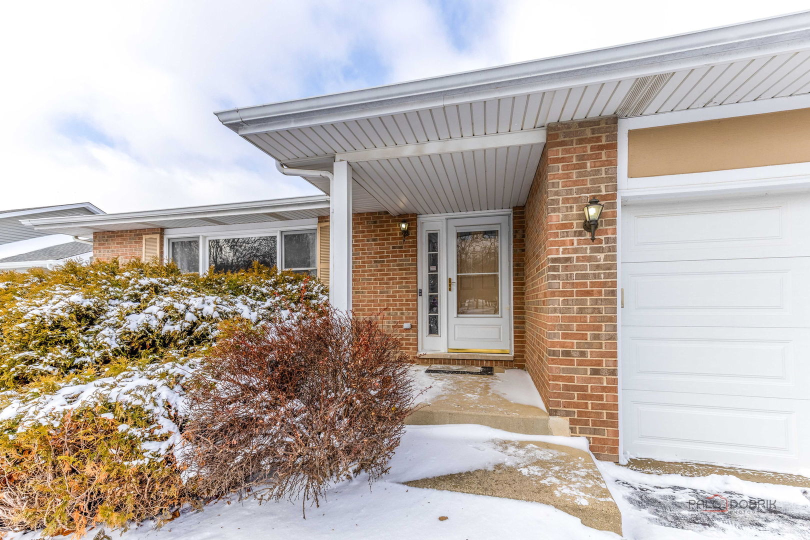 1716 Red Bud Road Bolingbrook, IL 60490 - Photo 3 of 38 a front view of a house with garden