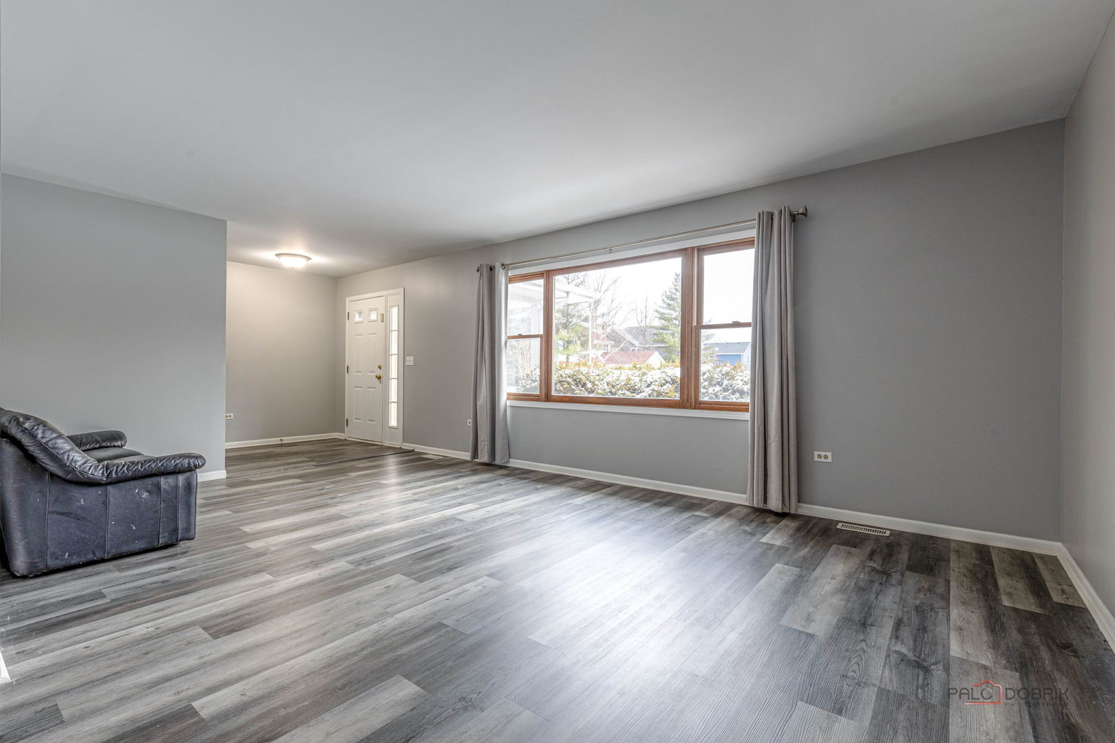 1716 Red Bud Road Bolingbrook, IL 60490 - Photo 6 of 38 an empty room with wooden floor and windows