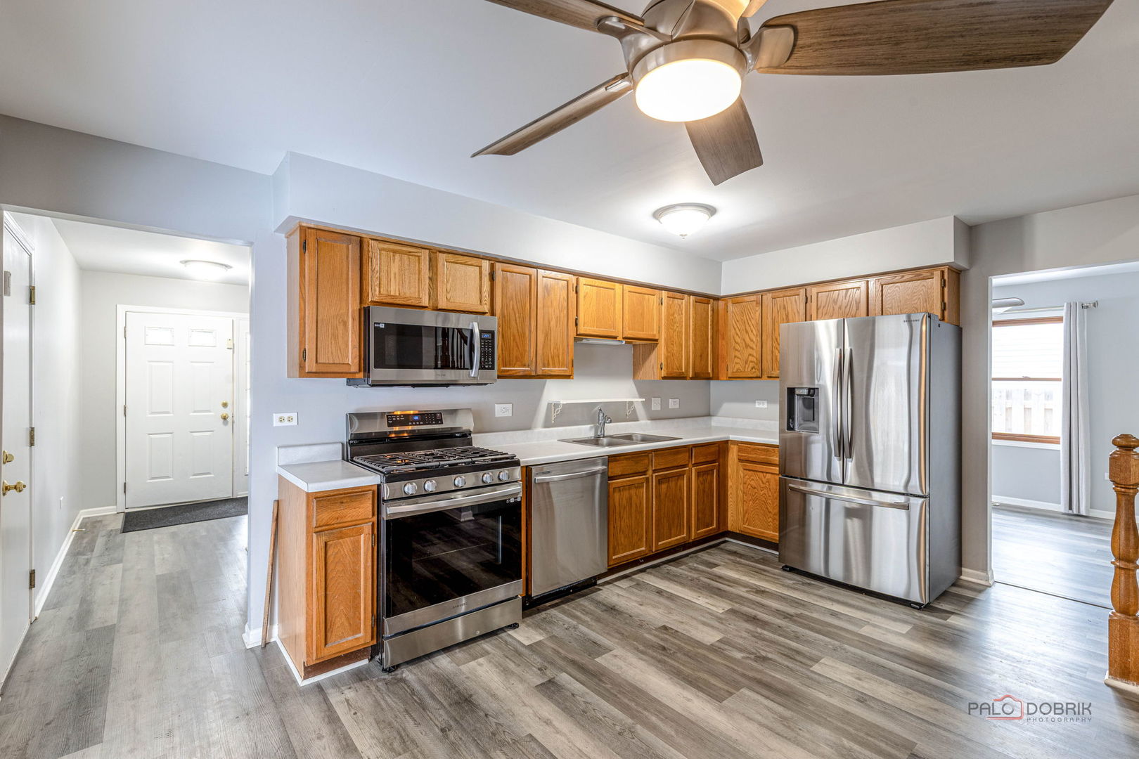 1716 Red Bud Road Bolingbrook, IL 60490 - Photo 8 of 38 a kitchen with stainless steel appliances granite countertop a stove refrigerator and microwave
