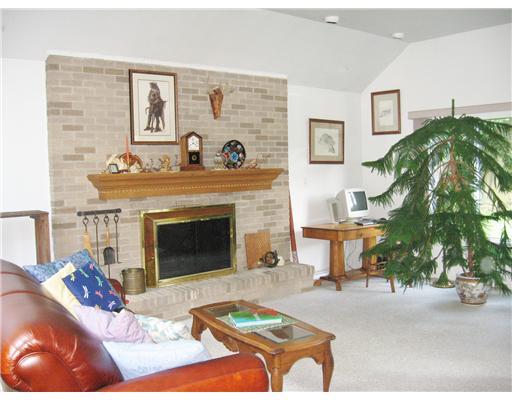 Living Room. Very Large Room, with Cathedral Ceiling, Numerous Windows, Recessed Lighting, Wall-to-wall Carpeting and Log-Burning, Brick Fire Place.