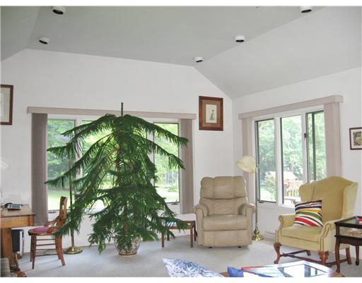 Living Room. Living Room looks out over expansive Rear Yard. Much Bird watching done here. Adjacent to Concervancy Property and Walking Trails, which means you will only/ever have neighbors on one side.