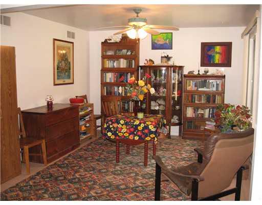 Dining Room. Present Owner uses this room as a Den. Light, Bright room. Paddle Fan/Light, and a Large Window. Ideal lighting for plant lovers.