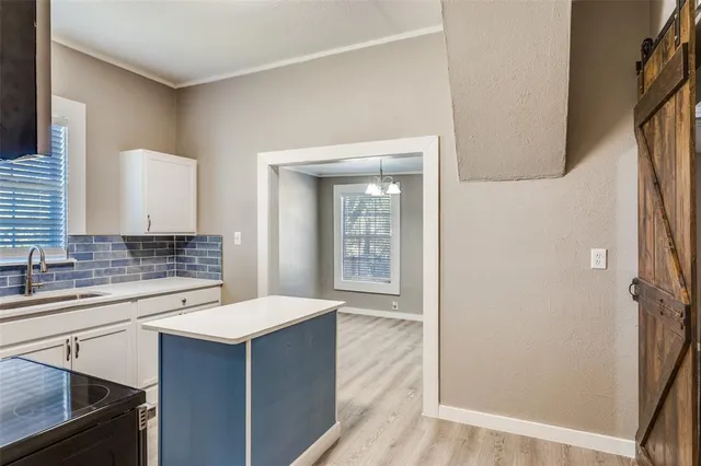 a bathroom with a sink a mirror and a shower