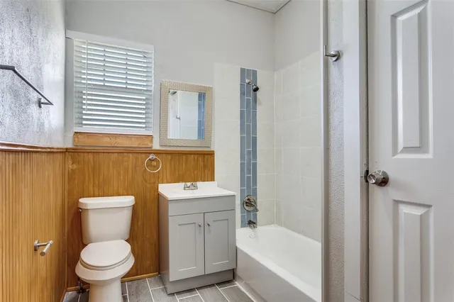 a bathroom with a toilet a sink and a bathtub