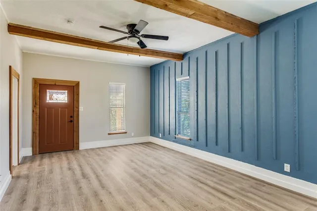 a view of an empty room with a window