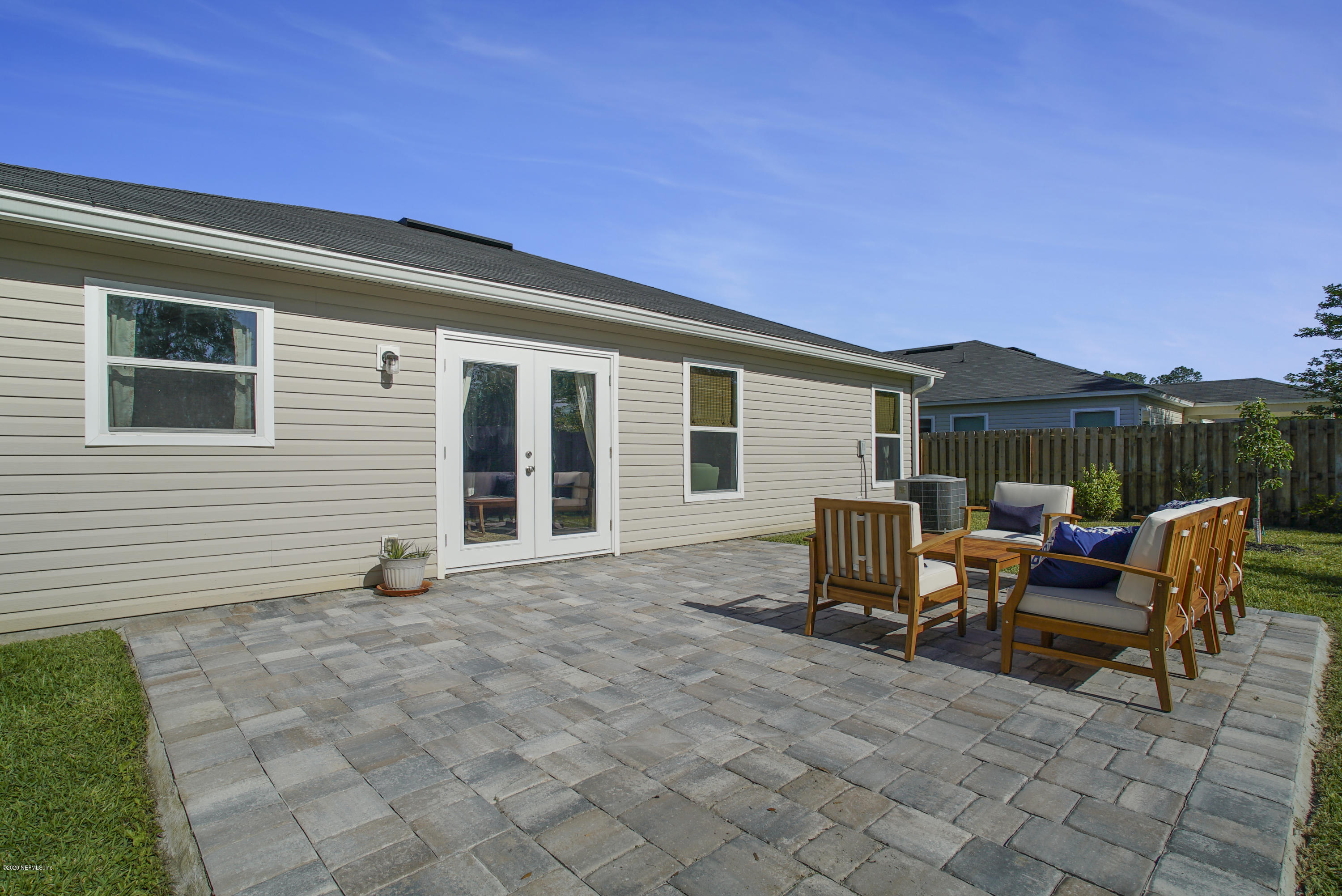 4447 Oak Moss Loop Middleburg, FL 32068 - Photo 29 of 36 a view of a house with backyard sitting area and garden