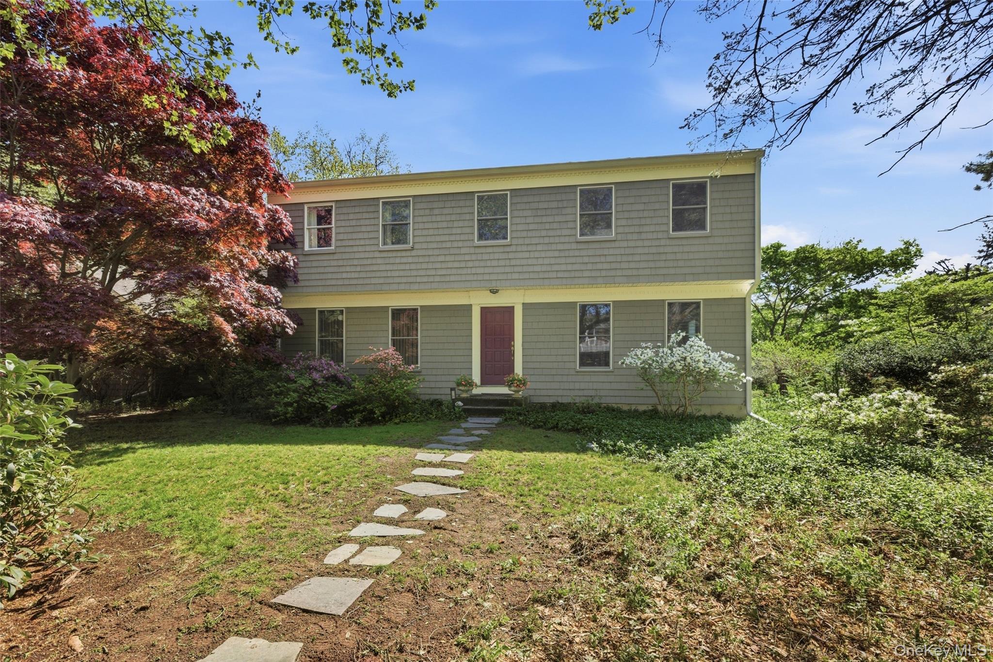 7 Gun Path Setauket, NY 11733 - Photo 1 of 34 a view of a backyard with plants and large tree