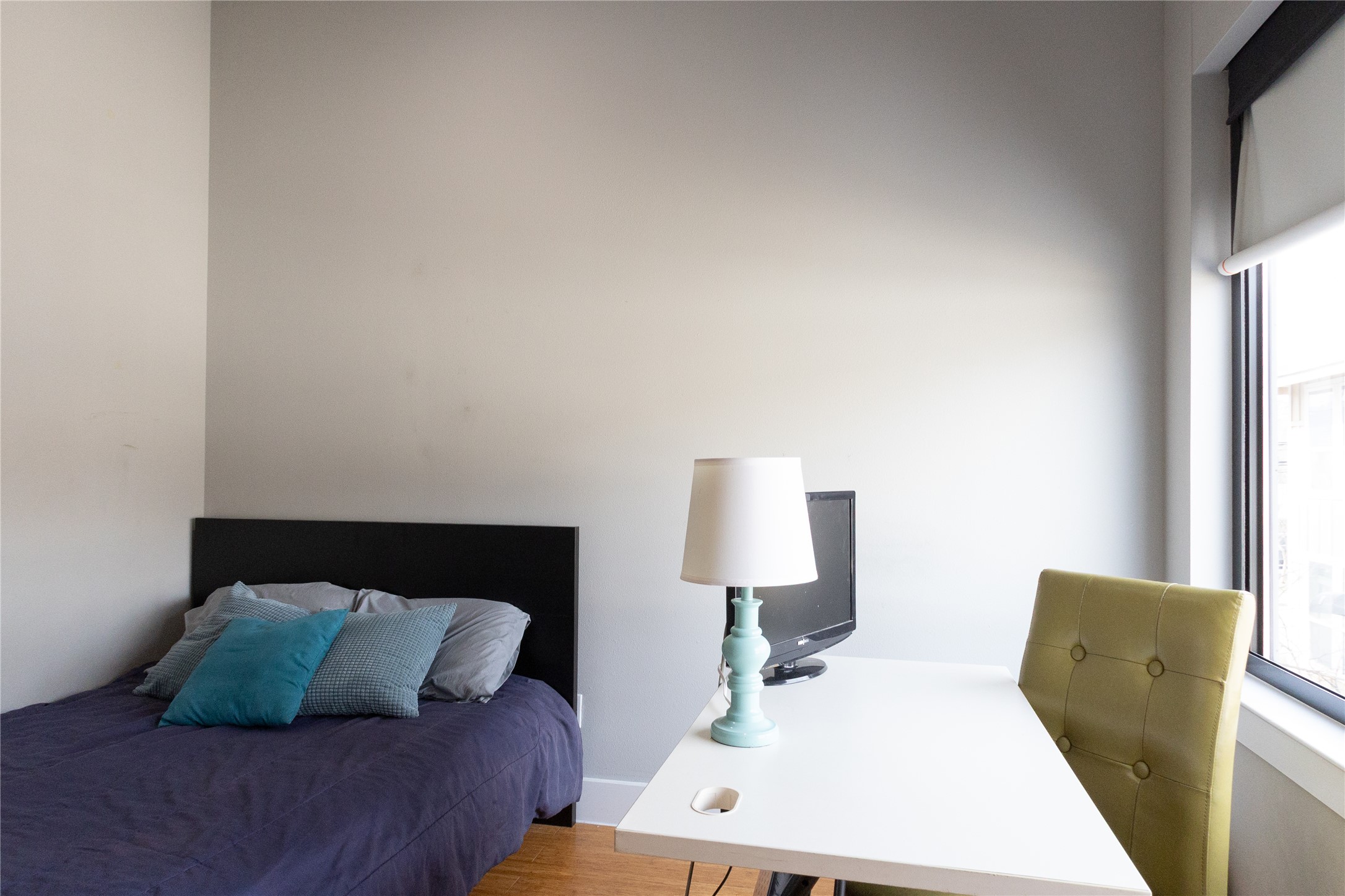 3000 Speedway, Unit C Austin, TX 78705 - Photo 13 of 20 a bed room with a bed window and a lamp