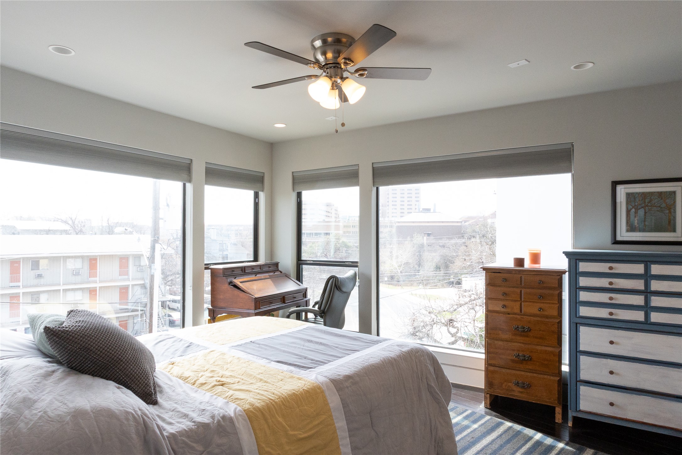 3000 Speedway, Unit C Austin, TX 78705 - Photo 10 of 20 a bedroom with a bed and large windows