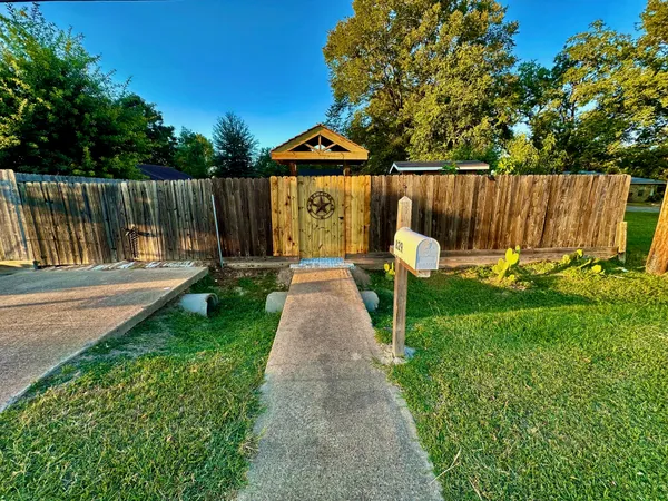 a garden with wooden fence