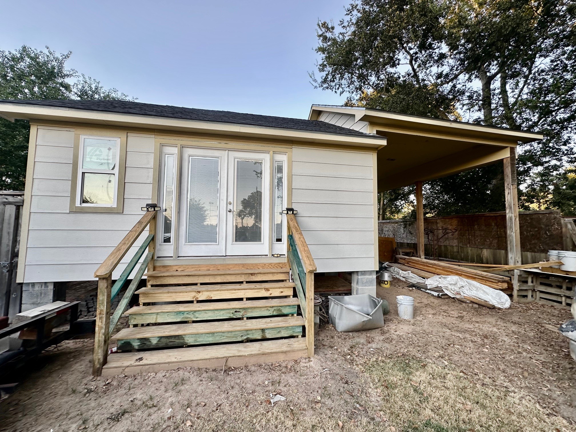 829 Timkin Road Tomball, TX 77375 - Photo 8 of 11 a view of a patio with table and chairs with wooden floor and fence