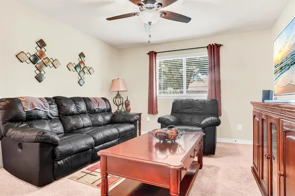 a living room with furniture and a window