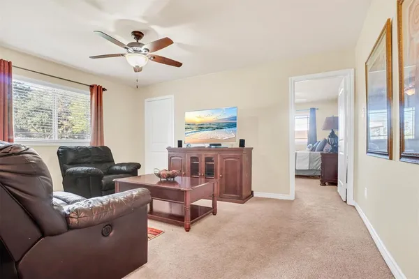 a living room with furniture and a window