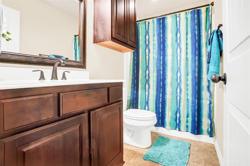 14095 Pecan Lane Forney, TX 75126 - Photo 29 of 40 a bathroom with a sink and a mirror