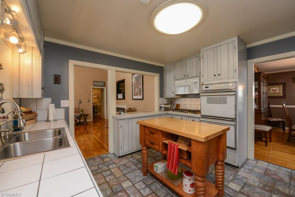 809 Sunset Drive High Point, NC 27262 - Photo 15 of 30 Open kitchen with island, double ovens, and gas range