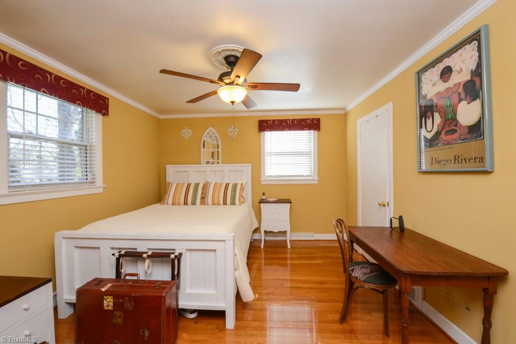 809 Sunset Drive High Point, NC 27262 - Photo 28 of 30 4th bedroom is off the sunroom. The laundry is off of this bedroom too. this area could be used as an airbnb suite