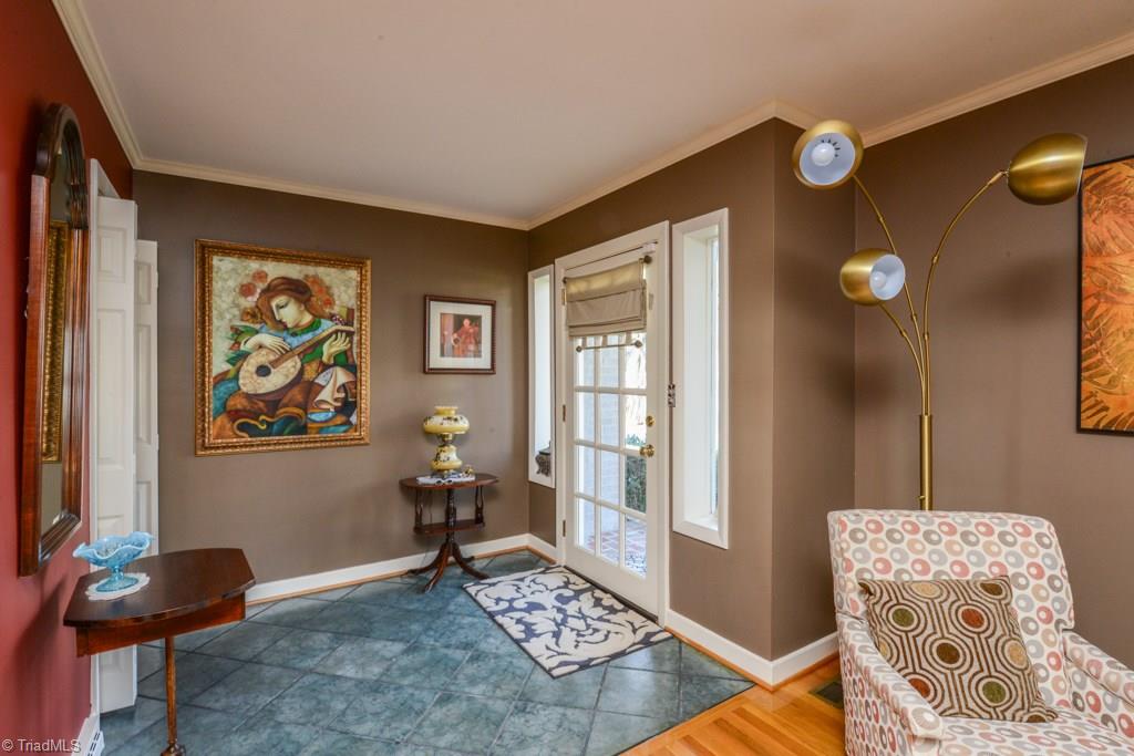Enter this home from the open foyer with cool tile flooring