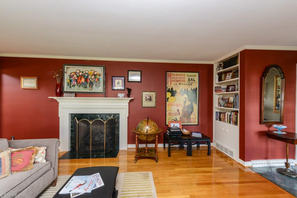 another view of living room with built in bookcases