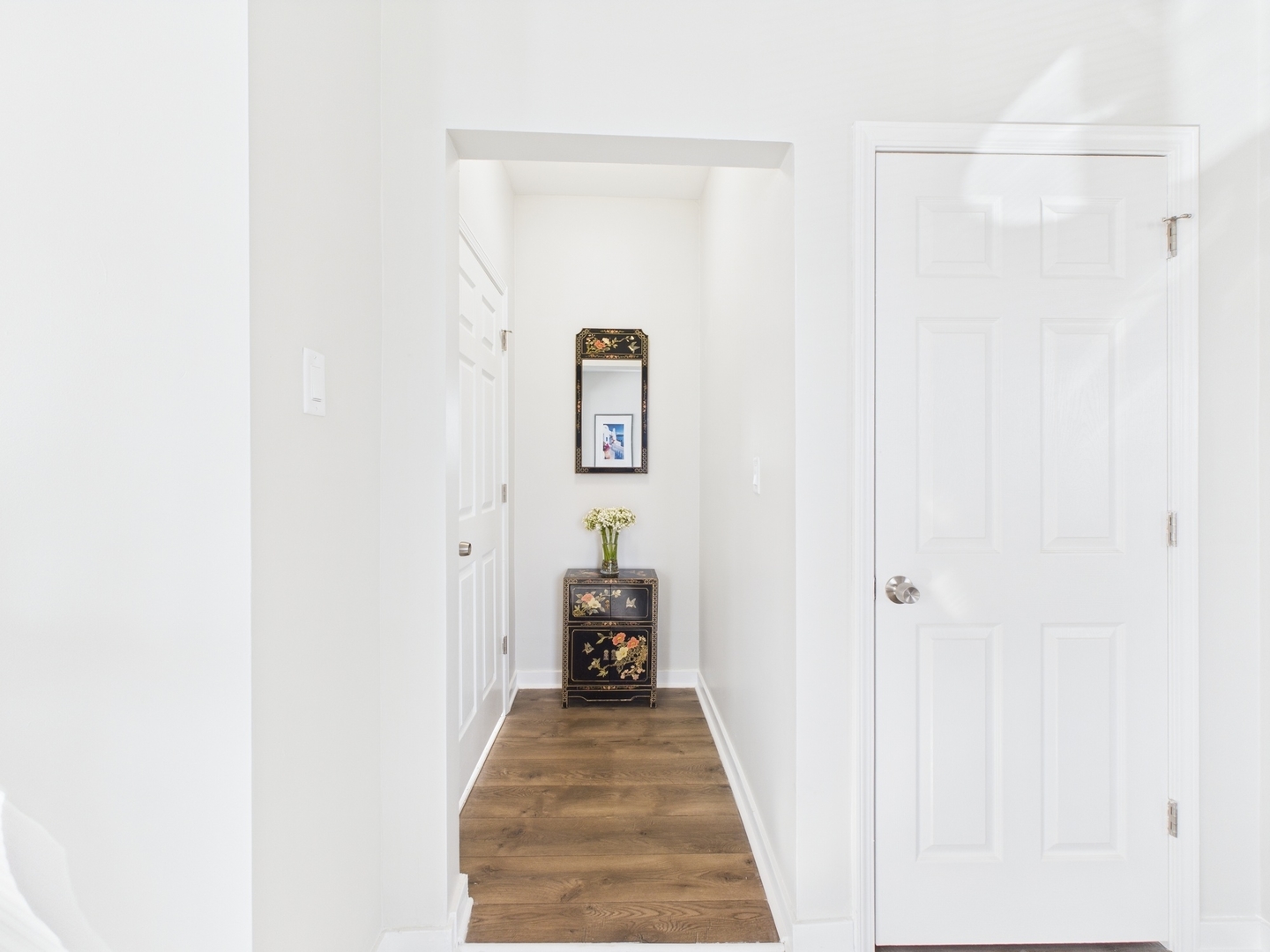 9151 South Normal Avenue Chicago, IL 60620 - Photo 7 of 34 a view of a hallway with wooden floor and a bathroom