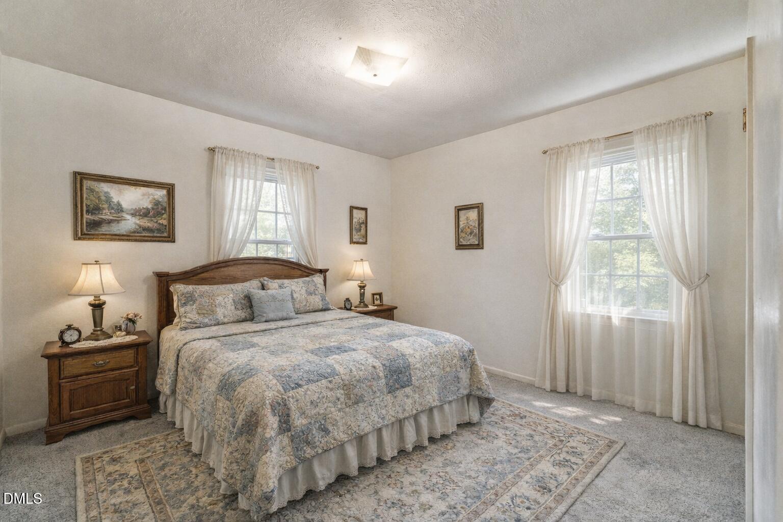 3115 Legion Road Hope Mills, NC 28348 - Photo 15 of 26 a bedroom with a bed and a window