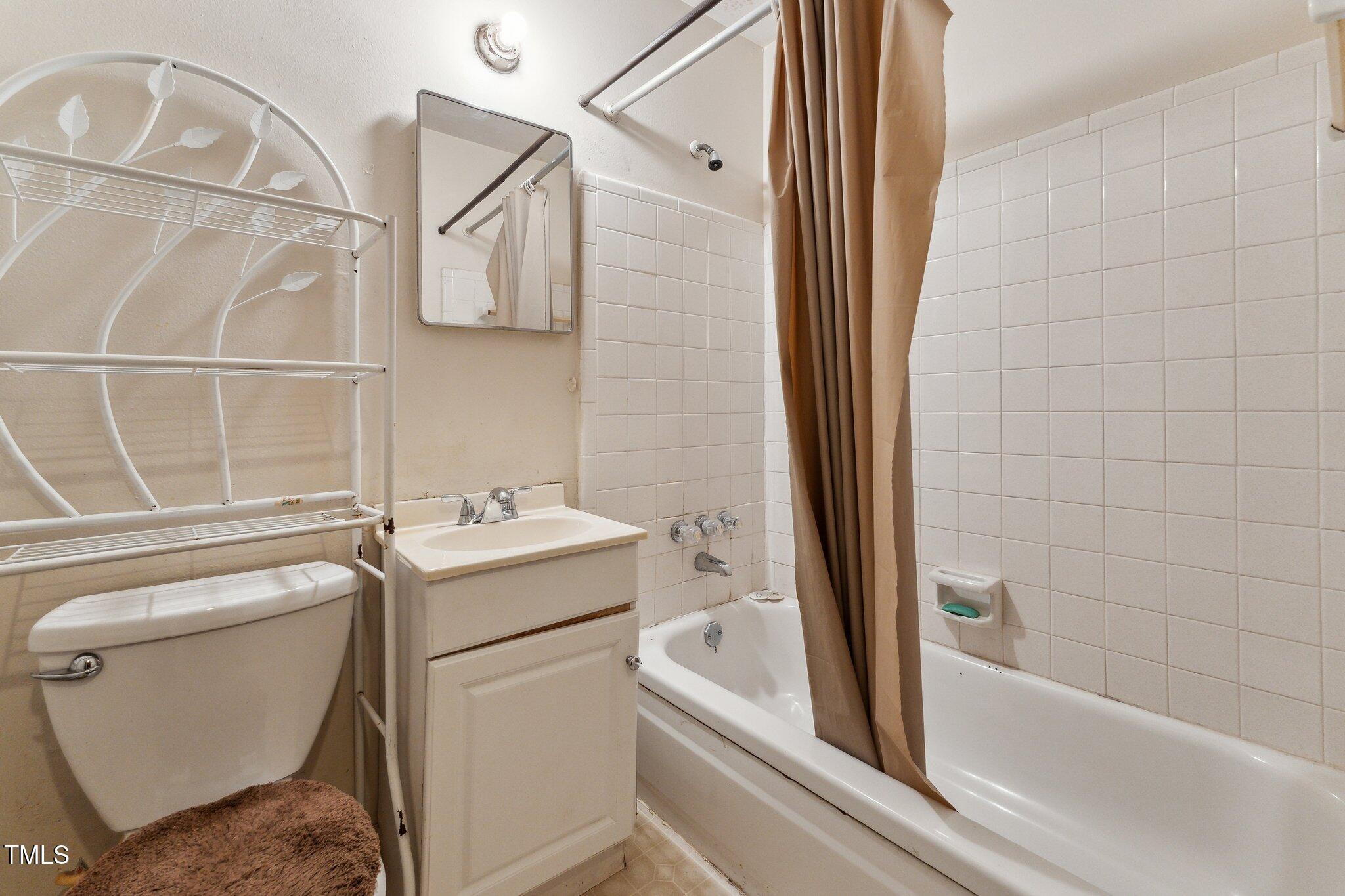 3115 Legion Road Hope Mills, NC 28348 - Photo 18 of 26 a bathroom with a sink and toilet