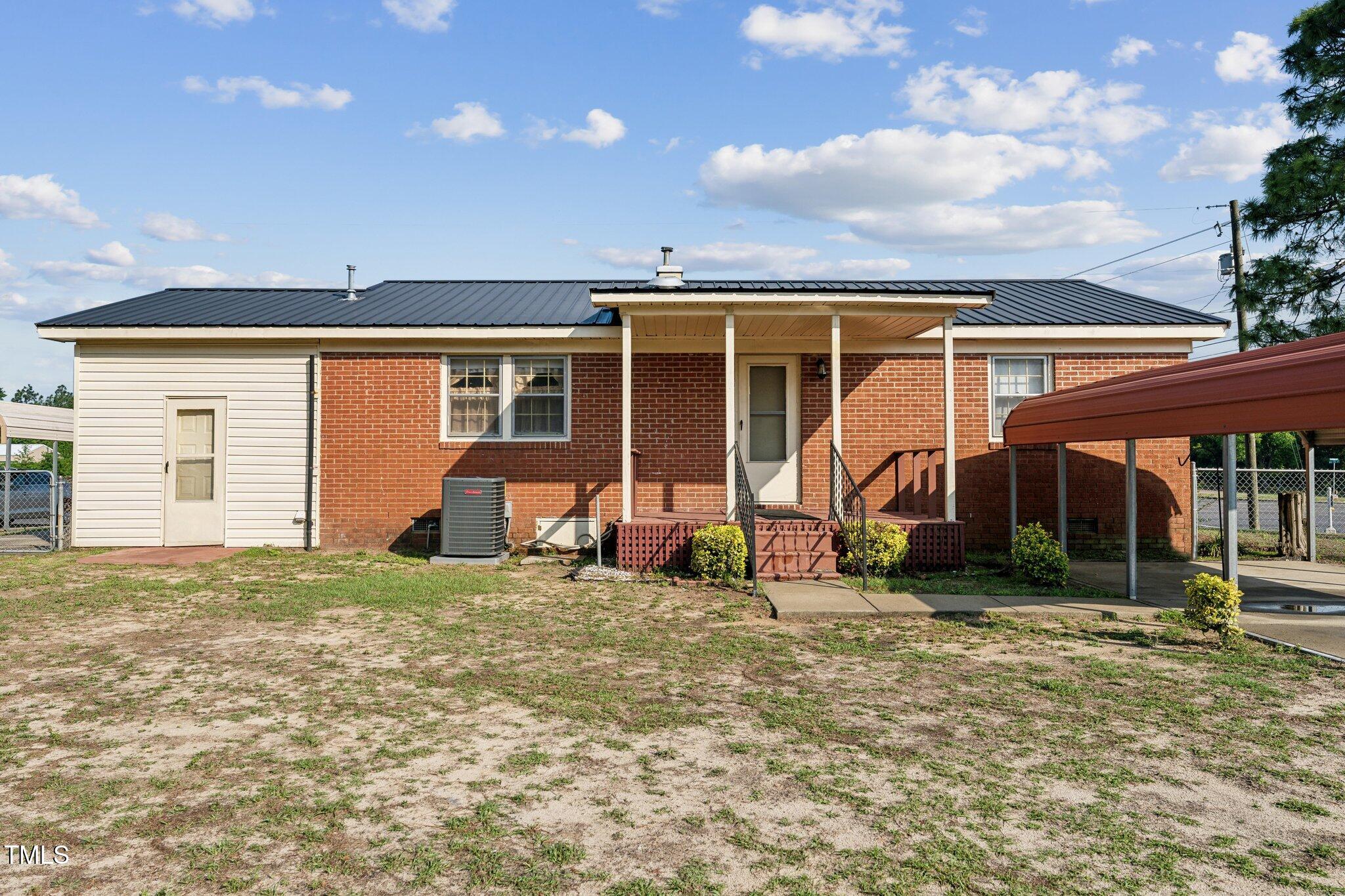 3115 Legion Road Hope Mills, NC 28348 - Photo 24 of 26 a view of a house with backyard