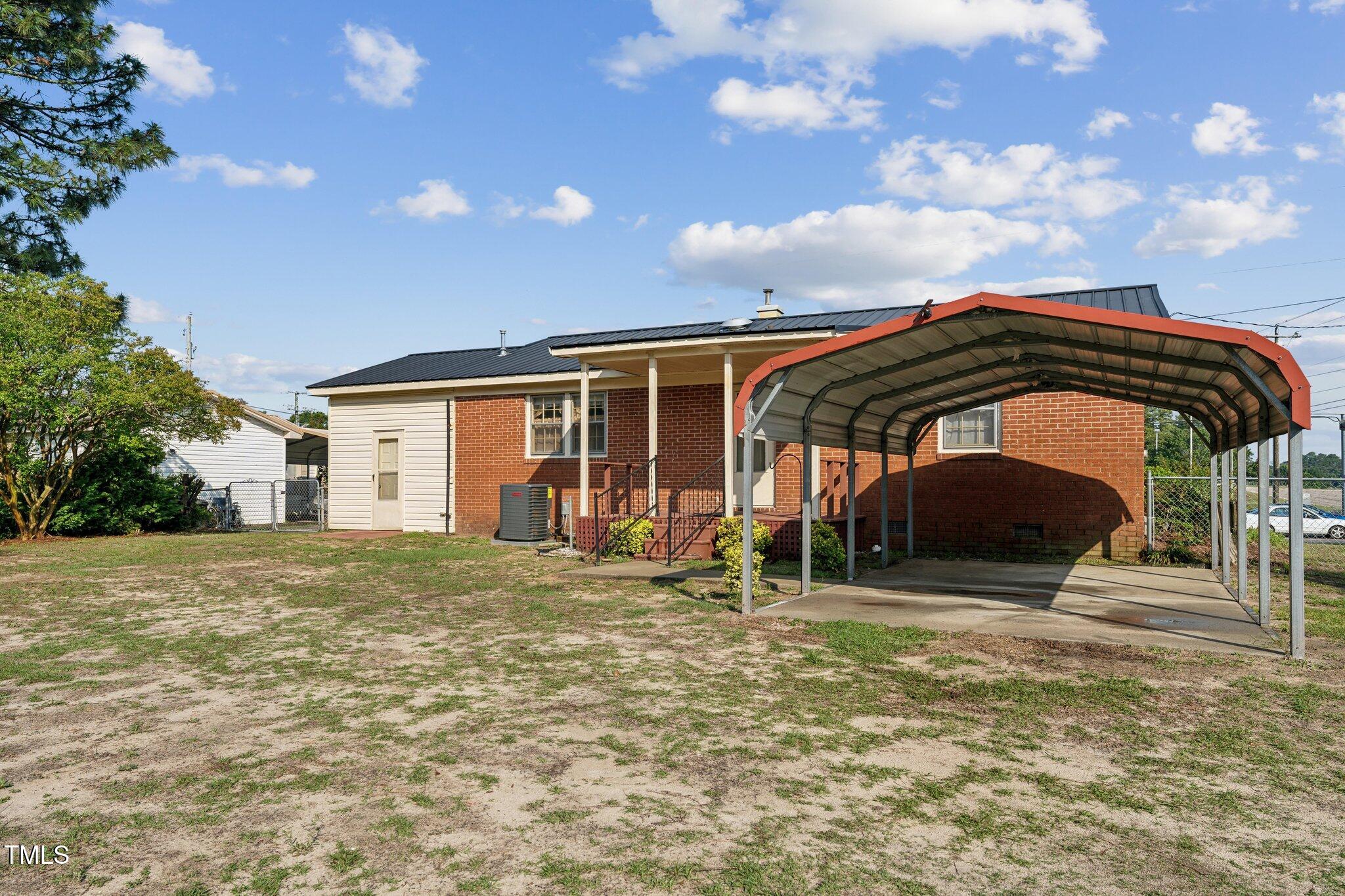3115 Legion Road Hope Mills, NC 28348 - Photo 25 of 26 a view of a house with backyard and porch