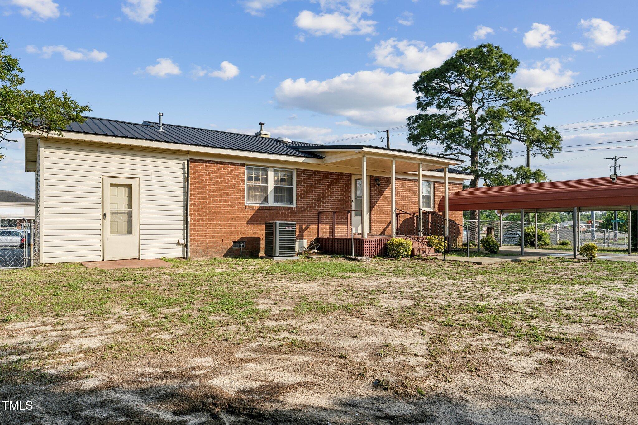 3115 Legion Road Hope Mills, NC 28348 - Photo 26 of 26 a house view with a backyard space