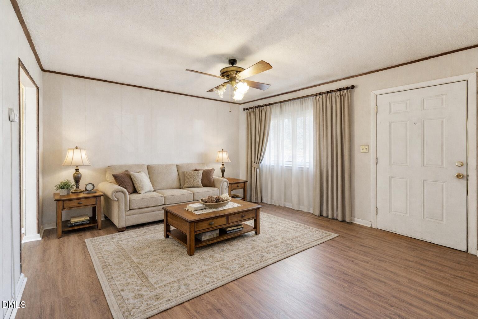 3115 Legion Road Hope Mills, NC 28348 - Photo 3 of 26 a living room with furniture and a chandelier